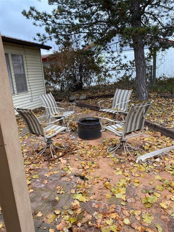 view of patio with an outdoor fire pit