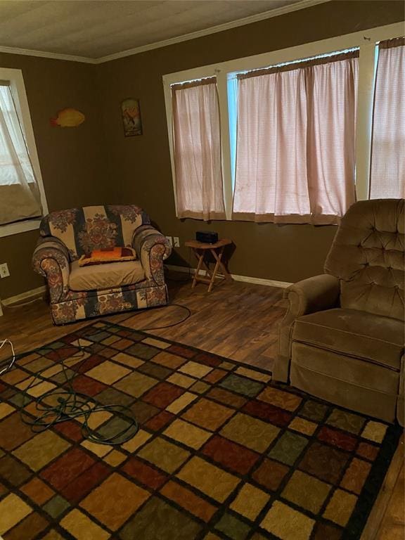 living room with hardwood / wood-style floors and crown molding