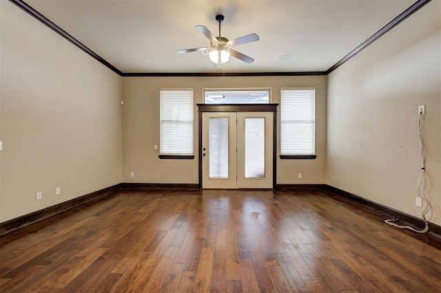 spare room featuring ceiling fan, dark wood-type flooring, and ornamental molding