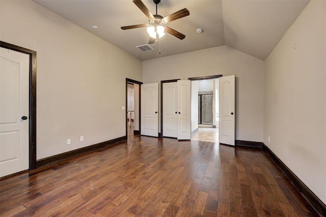 unfurnished bedroom with lofted ceiling, ceiling fan, and dark hardwood / wood-style floors