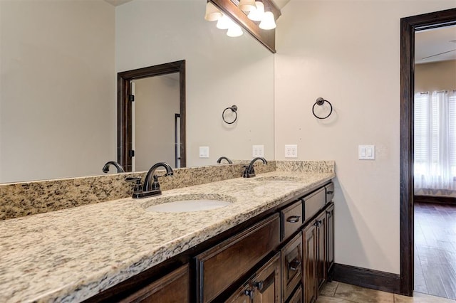 bathroom with vanity and hardwood / wood-style flooring