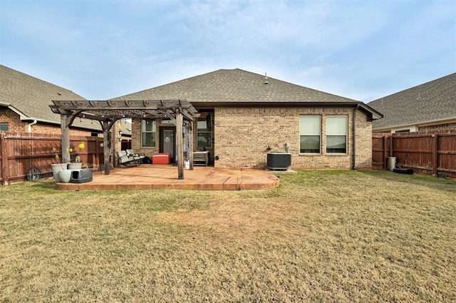 rear view of property featuring a pergola, central air condition unit, and a lawn