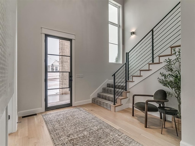 entryway featuring light hardwood / wood-style flooring and a healthy amount of sunlight