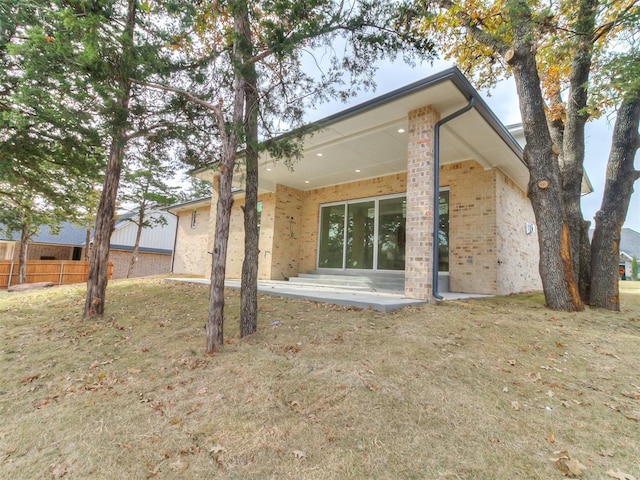 rear view of property featuring a patio