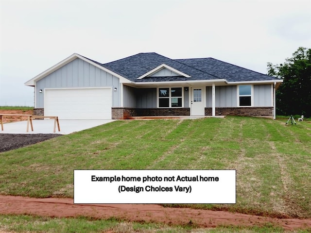 view of front of home with a front lawn and a garage