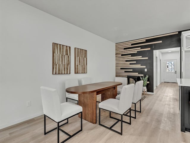 dining space with light hardwood / wood-style floors