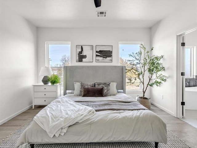 bedroom featuring light hardwood / wood-style floors and ceiling fan