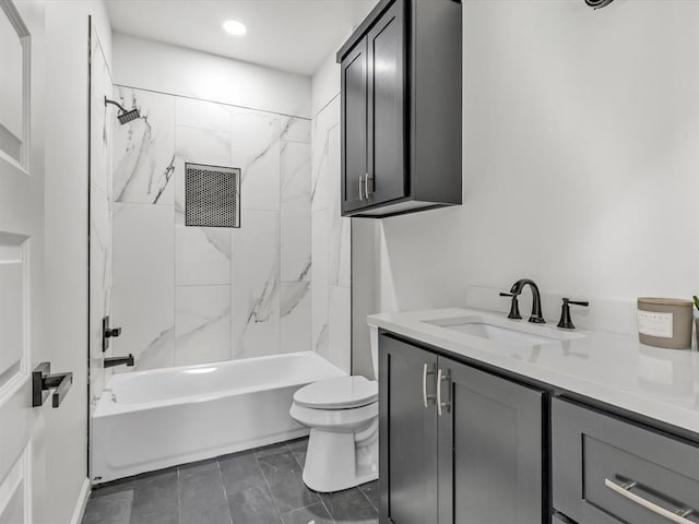 full bathroom with vanity, toilet, and tiled shower / bath combo