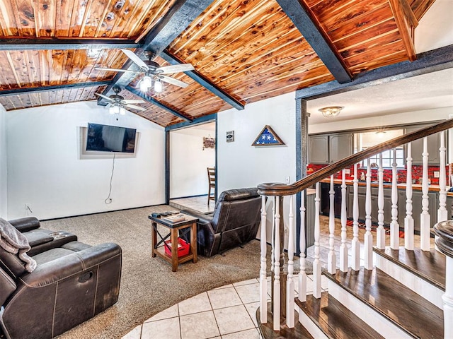 living room with lofted ceiling with beams, ceiling fan, light colored carpet, and wooden ceiling