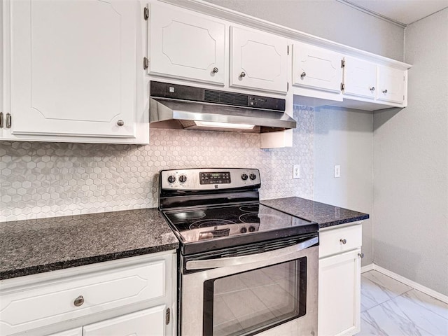 kitchen with backsplash, white cabinetry, dark stone counters, and electric stove