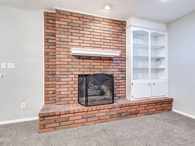 unfurnished living room with carpet and a brick fireplace