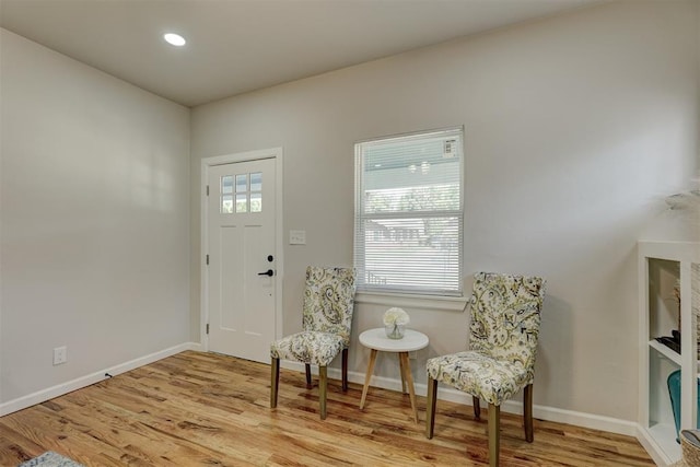 living area with light hardwood / wood-style floors