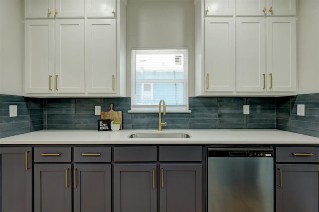 kitchen with dishwasher, white cabinets, and sink