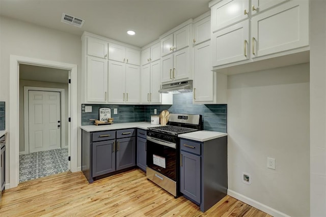 kitchen with white cabinetry, light wood-type flooring, and stainless steel gas range