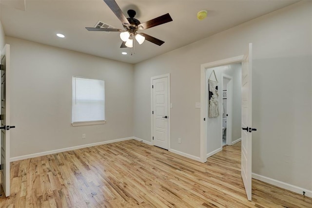 unfurnished bedroom featuring light hardwood / wood-style flooring and ceiling fan