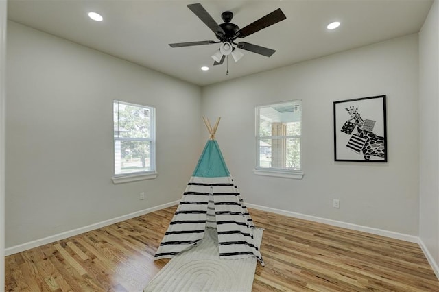 interior space featuring ceiling fan and light wood-type flooring