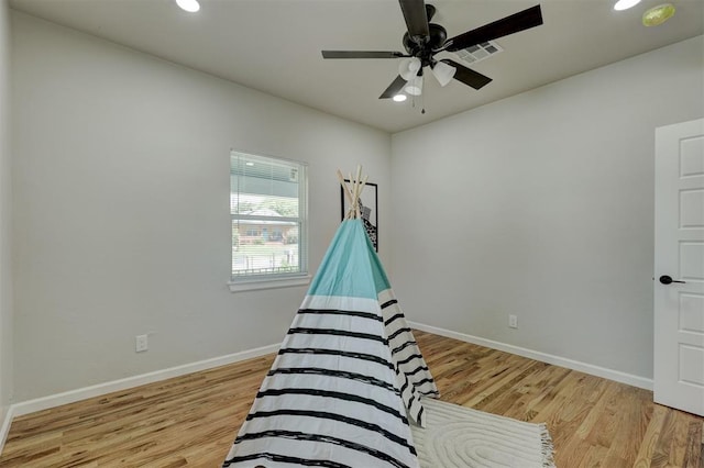 bedroom with ceiling fan and light wood-type flooring