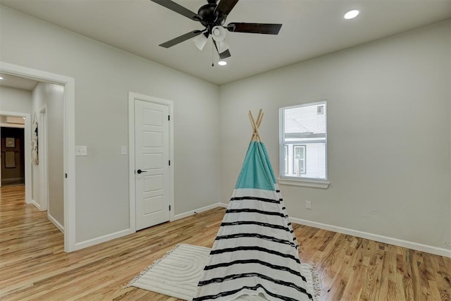 interior space featuring ceiling fan and light wood-type flooring