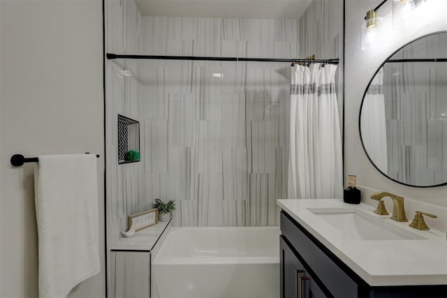 bathroom featuring vanity and shower / bath combination with curtain