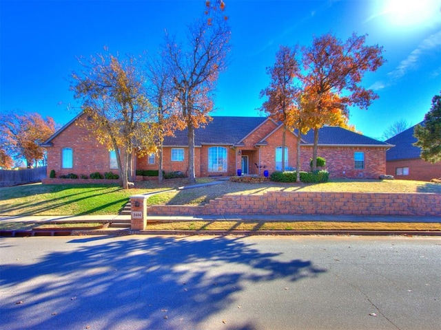 ranch-style house with a front yard