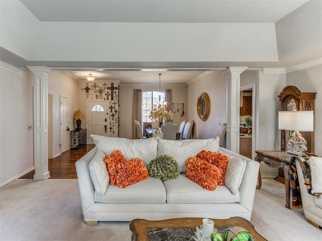 living room featuring crown molding, light hardwood / wood-style flooring, and a chandelier