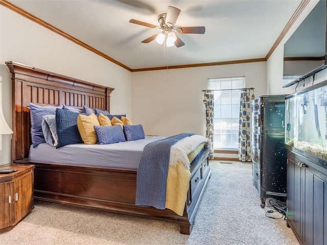 bedroom with ceiling fan, light colored carpet, and crown molding