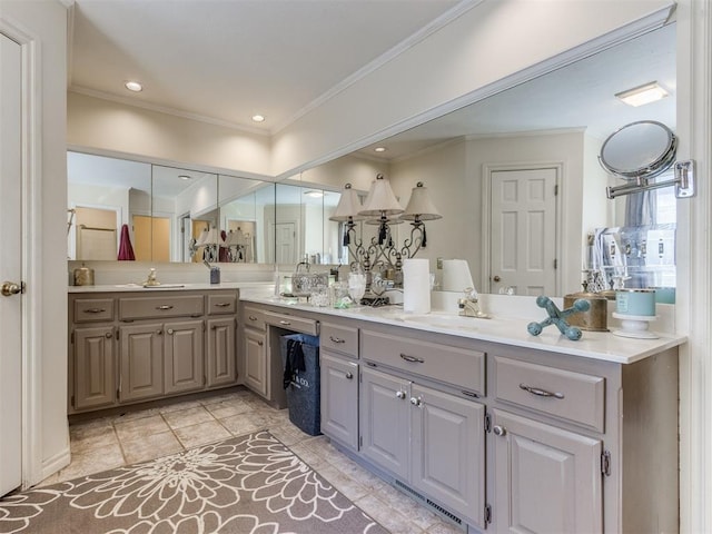 bathroom with crown molding and vanity