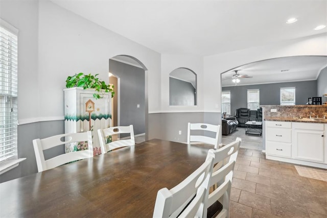 dining space with light tile patterned flooring, ceiling fan, and a wealth of natural light