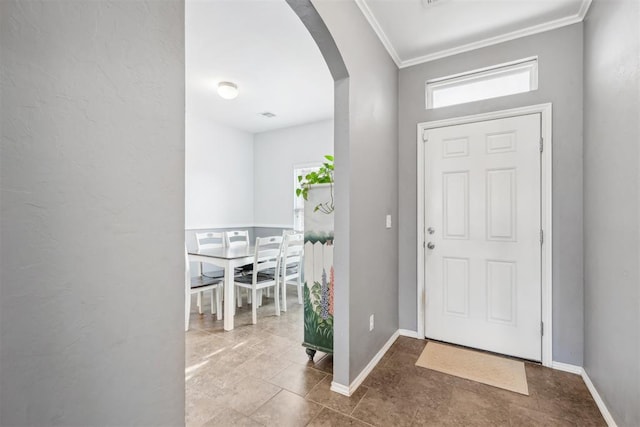 entrance foyer featuring crown molding