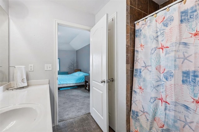 bathroom featuring sink and a shower with curtain