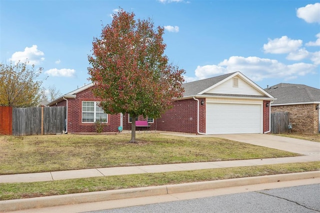 view of front of home featuring a garage and a front yard