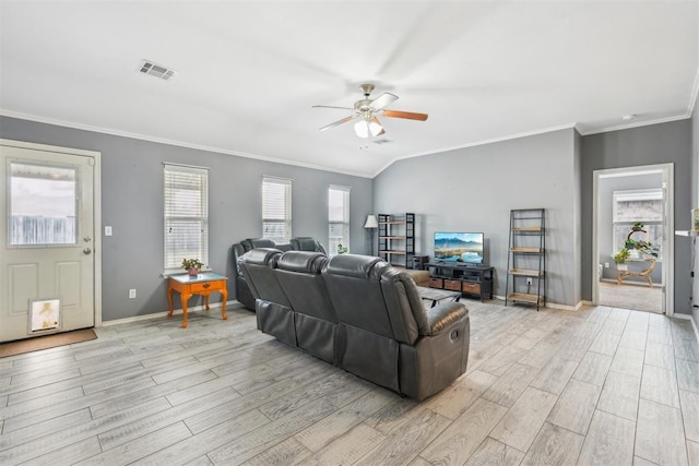 living room with lofted ceiling, ornamental molding, and ceiling fan