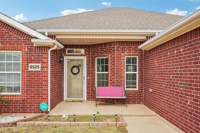 entrance to property with a patio