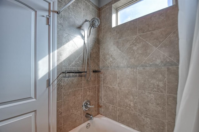 bathroom with shower / bath combo with shower curtain