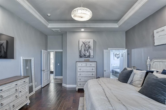 bedroom with a raised ceiling, dark hardwood / wood-style flooring, and crown molding