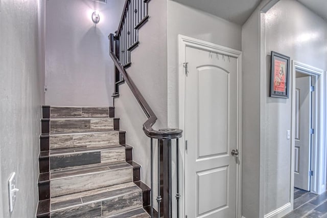 staircase with wood-type flooring