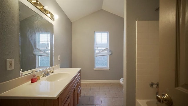 full bathroom with tile patterned flooring, lofted ceiling, toilet, vanity, and bathtub / shower combination