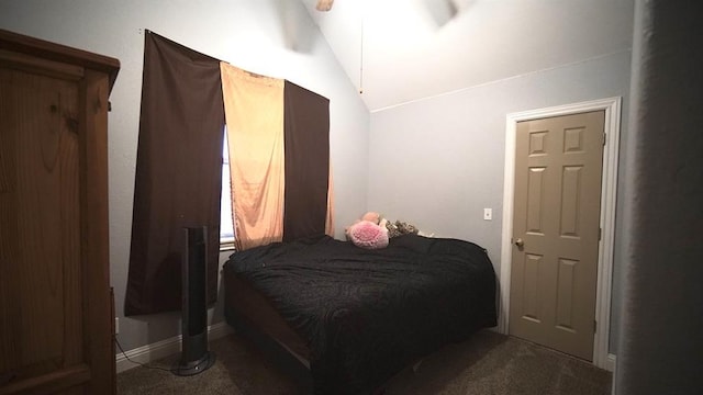 carpeted bedroom featuring vaulted ceiling