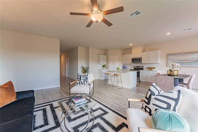 living room featuring ceiling fan