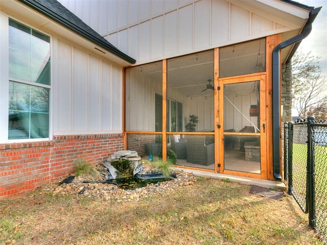 view of home's exterior with a sunroom