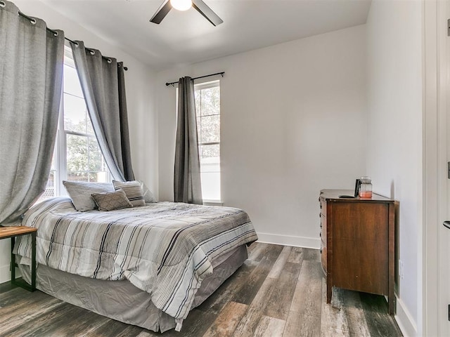 bedroom featuring ceiling fan and dark hardwood / wood-style flooring