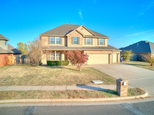 view of front of home featuring a front yard and a garage