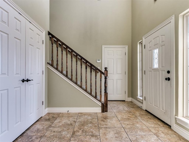 foyer with a towering ceiling