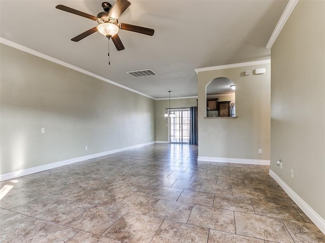 spare room featuring ceiling fan and ornamental molding