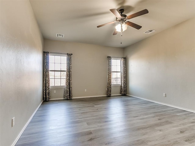 spare room featuring ceiling fan and wood-type flooring