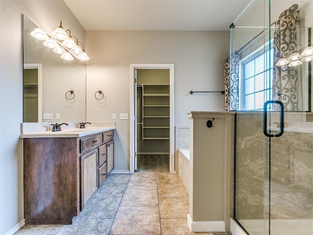 bathroom featuring vanity and shower with separate bathtub