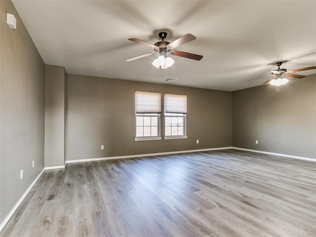 unfurnished room featuring light hardwood / wood-style flooring and ceiling fan