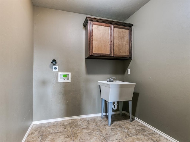 laundry room with cabinets and washer hookup