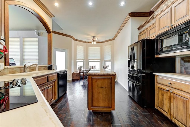 kitchen with sink, ceiling fan, dark wood-type flooring, and black appliances