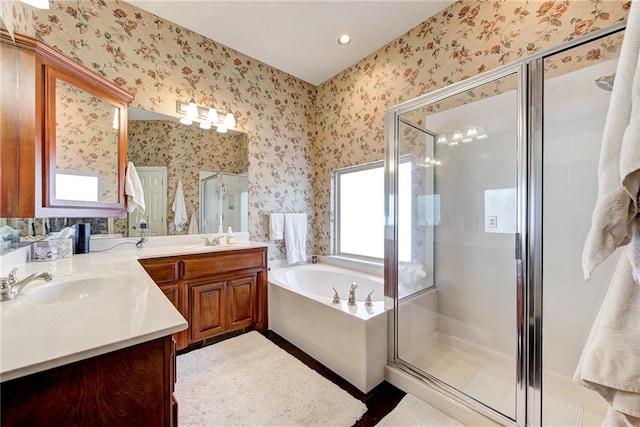 bathroom featuring vanity and shower with separate bathtub